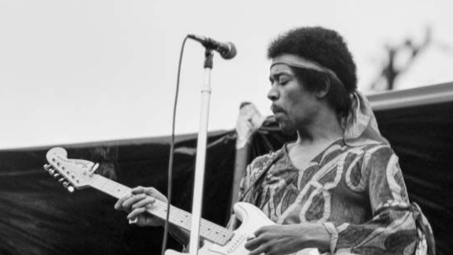 Image: Jimi Hendrix, shown performing at Sicks Stadium in 1970, was one of the local artists who Patrick MacDonald wrote about during his long career with the Seattle Times. (Photo courtesy of MOHAI via Feliks Banel.)