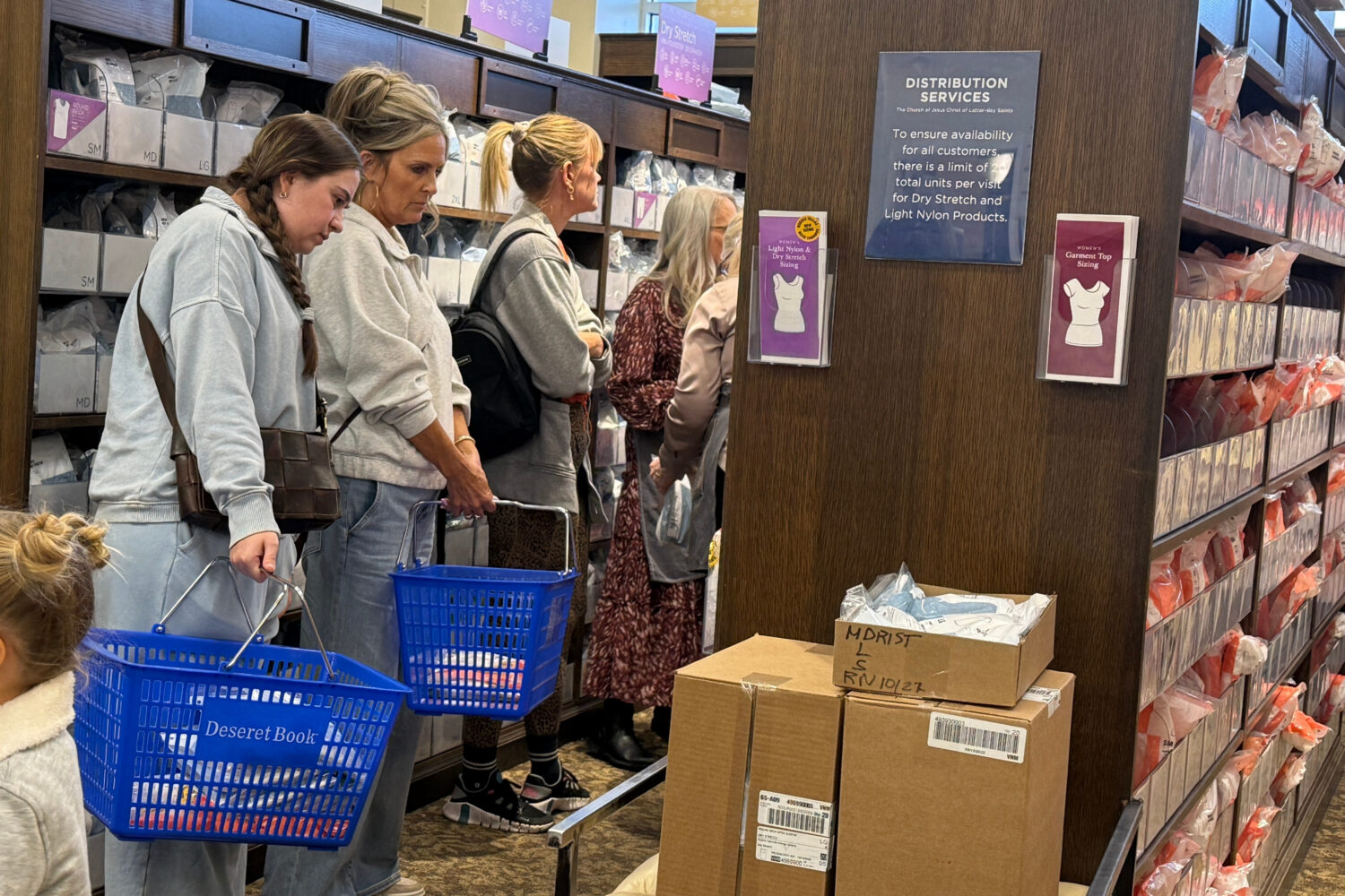 Members of The Church of Jesus Christ of Latter-day Saints shop for new sleeveless sacred garments ...