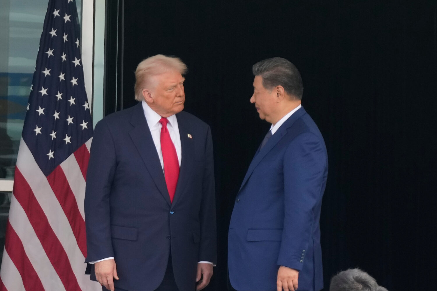 President Donald Trump, left, and Chinese President Xi Jinping, look at each other after their summ...