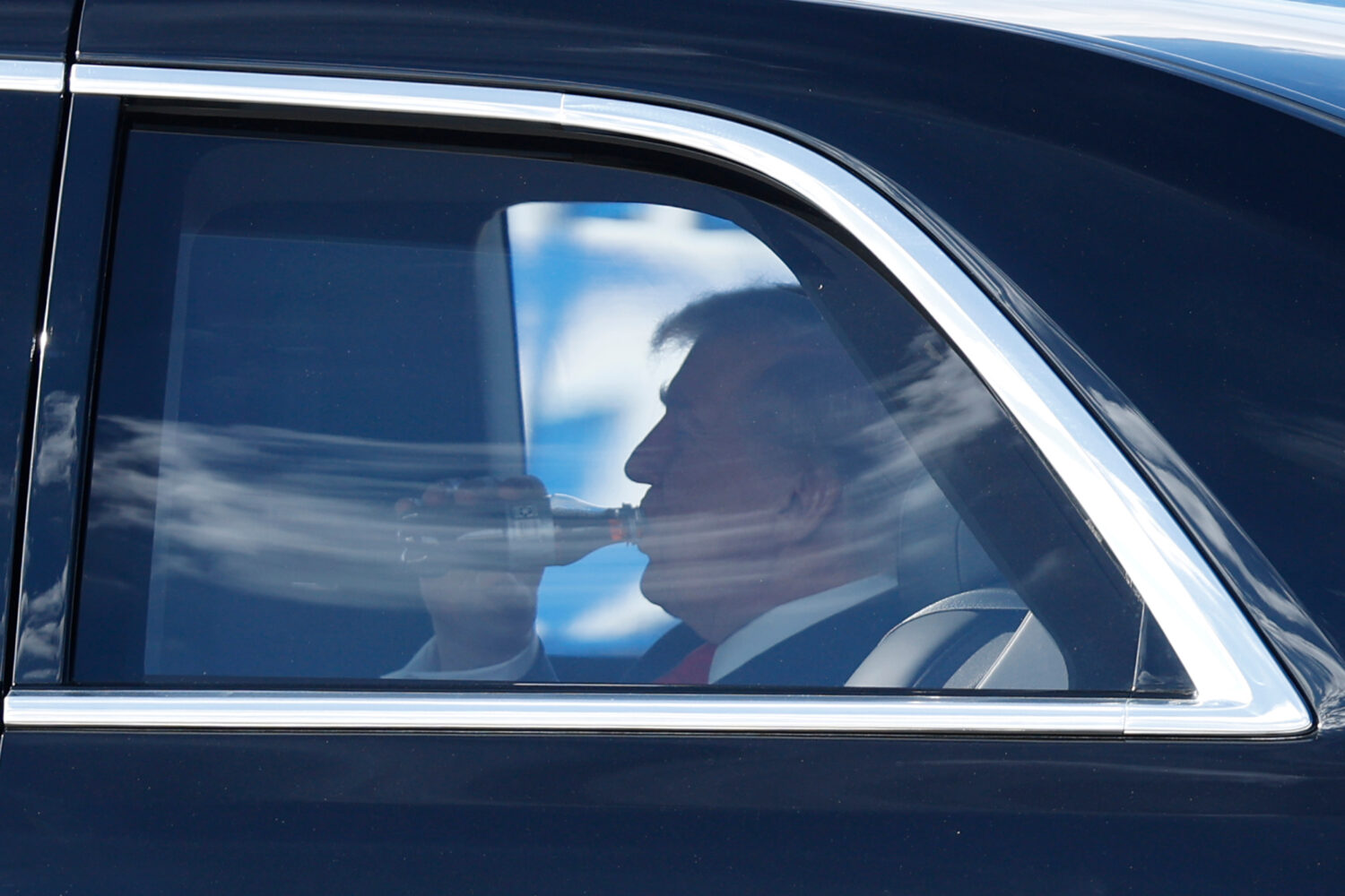 President Donald Trump is seen in his limousine, known as "The Beast," upon his arrival at Joint Ba...